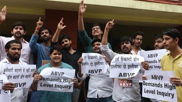Akhil Bharatiya Vidyarthi Parishad (ABVP) activists and students of law raise slogans as they protest against LLM paper leak and LLB entrance exam, outside Dean's office at Delhi University. (Sonu Mehta / HT Photo) Akhil Bharatiya Vidyarthi Parishad (ABVP) activists and students of law raise slogans as they protest against LLM paper leak and LLB entrance exam, outside Dean's office at Delhi University. (Sonu Mehta / HT Photo)