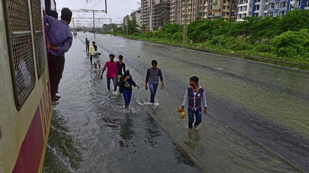 Waterlogging on the railway track between Vasai and Nallasopara on July 11, 2018. When it rains, thousands of residents of the Virar, Vasai and Nallasopara areas find themselves cut off from Mumbai where most of them travel to work via the suburban rail network. The tracks are often under water throwing suburban rail services out of order. (Vijayanand Gupta / HT Photo)