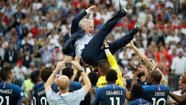 France's coach Didier Deschamps is thrown in the air after the final whistle of the FIFA World Cup 2018 final against Croatia at the Luzhniki Stadium in Moscow.(AFP)