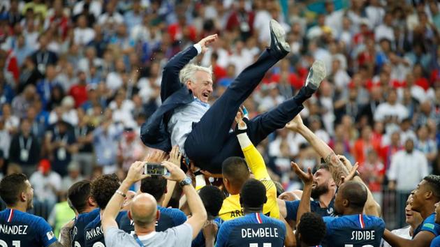 France's coach Didier Deschamps is thrown in the air after the final whistle of the Russia 2018 World Cup final football match between France and Croatia at the Luzhniki Stadium in Moscow, July 15(AFP)