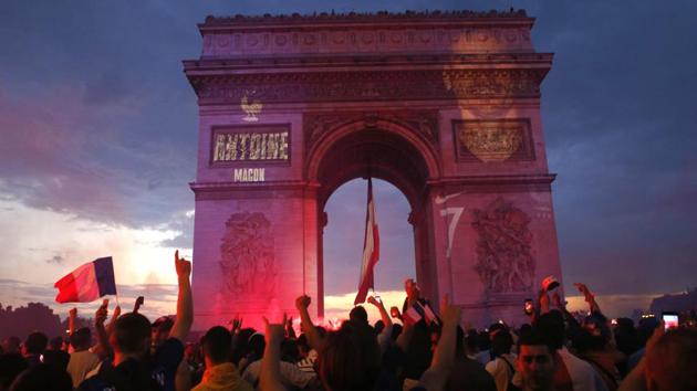 In Paris, where 90,000 people watched the match on vast TV screens next to the Eiffel tower, there were choruses of the Marseillaise, honking horns and hundreds of thousands of red, white and blue tricolor flags fluttering on the breeze. (AP) 