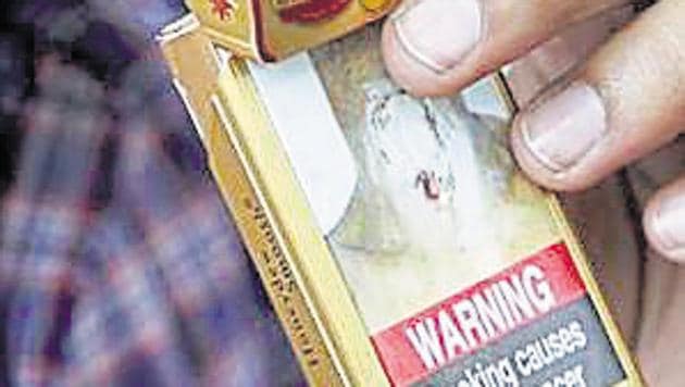 In this Wednesday, Nov. 2, 2016 photo, a man takes a cigarette from a pack in New Delhi, India.(AP) In this Wednesday, Nov. 2, 2016 photo, a man takes a cigarette from a pack in New Delhi, India.(AP)