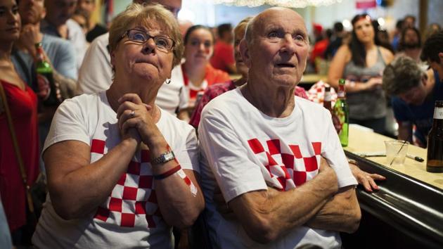Croatia fans Joyce Simunovic, left, and her husband, Nikola Simunovic, right, watch the television in the last minutes of the World Cup match. (AP) 