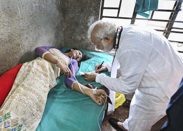Prime Minister Narendra Modi visits a woman who was injured after a portion of a tent collapsed at his rally at a hospital in Midnapore, West Bengal. More than 20 people were injured in the incident during Prime Minister Modi’s speech at a public rally. “Fortunately, none of them has got severe injuries,” Samit Dash, president of West Midnapore district unit of the BJP, said. (PTI) Prime Minister Narendra Modi visits a woman who was injured after a portion of a tent collapsed at his rally at a hospital in Midnapore, West Bengal. More than 20 people were injured in the incident during Prime Minister Modi’s speech at a public rally. “Fortunately, none of them has got severe injuries,” Samit Dash, president of West Midnapore district unit of the BJP, said. (PTI)