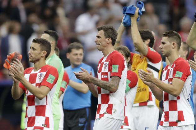 From left to right - Croatia's Josip Pivaric, Mario Mandzukic and Marko Pjaca applaud after losing the final. (AP) 