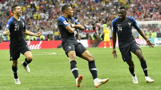 France's Kylian Mbappe, center, celebrates after scoring his side's fourth goal. (AP) 