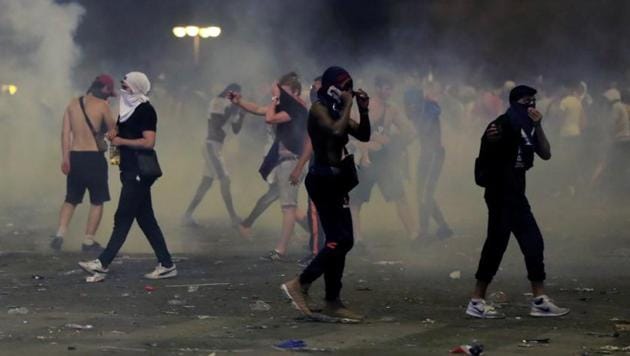The entire area around the Arc de Triomphe, all the way down the two-kilometre-long Champs Elysees and the Place de la Concorde at its end was a sea of singing and cheering people. (reuters) 
