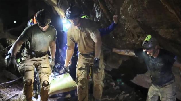 Rescue personnel carrying a member of the "Wild Boars" on a stretcher during the rescue operation inside the Tham Luang cave in Khun Nam Nang Non Forest Park in Mae Sai district, Thailand.(AFP/ Royal Thai Navy)