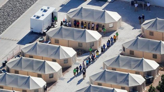 Immigrant children now housed in a tent encampment under the new ‘zero tolerance’ policy by the Trump administration are shown walking in single file at the facility near the Mexican border in Tornillo, Texas.(Reuters File)