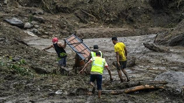Rescue workers and local people engaged in rescue works at landslide seen at Kattippara in Kozhikode. (PTI File Photo) Rescue workers and local people engaged in rescue works at landslide seen at Kattippara in Kozhikode. (PTI File Photo)