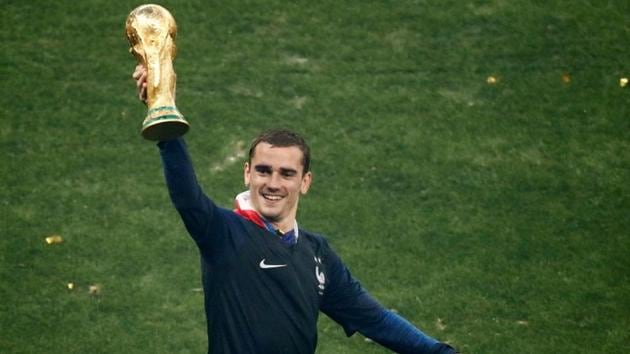 France's Antoine Griezmann holds the trophy as he celebrates winning the FIFA World Cup at the Luzhniki Stadium in Moscow.(Reuters)