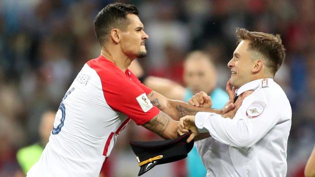 Croatia's Dejan Lovren clashes with a pitch invader during the FIFA World Cup 2018 final.(REUTERS)