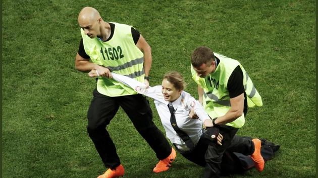 The four members of Pussy Riot feminist punk group ran onto the pitch at Moscow’s Luzhniki stadium on Sunday and briefly halted play in the second half of the match between France and Croatia, watched by President Vladimir Putin and world leaders. (Twitter/@pussyrrriot) The four members of Pussy Riot feminist punk group ran onto the pitch at Moscow’s Luzhniki stadium on Sunday and briefly halted play in the second half of the match between France and Croatia, watched by President Vladimir Putin and world leaders. (Twitter/@pussyrrriot)