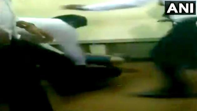 Lawyers thrashing an accused, who sexually harassed an 11-year-old girl for over a period of 7 months, at the Mahila Court in Chennai. (ANI Photo) Lawyers thrashing an accused, who sexually harassed an 11-year-old girl for over a period of 7 months, at the Mahila Court in Chennai. (ANI Photo)