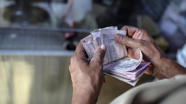 Strength in dollar overseas, as investors awaited US Federal Reserve Chairman Jerome Powell’s first congressional testimony for hints on the pace of interest rate hikes, capped rupee’s gains, traders said. (Dhiraj Singh/Bloomberg)