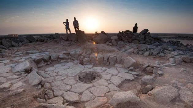 A stone structure at an archeological site containing a fireplace, seen in the middle, where charred remains of 14,500-year-old bread was found in the Black Desert, in northeastern Jordan.(Reuters)
