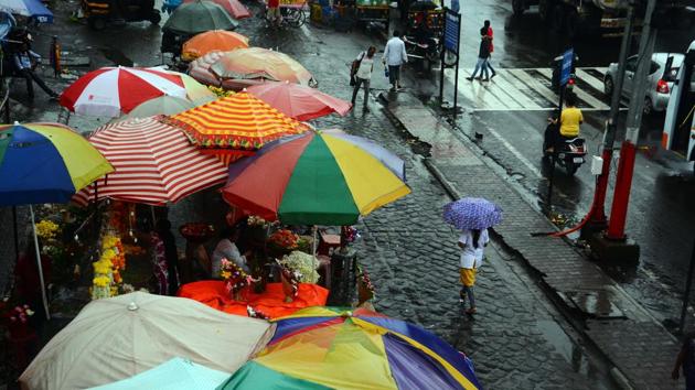 It was umbrellas to the fore across the city on Monday, with residents fighting the heavy rain. (Shankar Narayan/HT PHOTO) It was umbrellas to the fore across the city on Monday, with residents fighting the heavy rain. (Shankar Narayan/HT PHOTO)