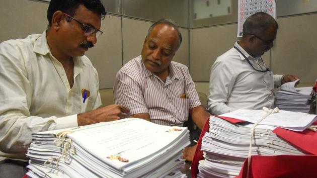 Officials checking affidavits of police and government officials submitted by advocate Shishir Hire regarding the Bhima Koregaon violence at council hall in Pune on Monday. (SANKET WANKHADE/HT PHOTO) Officials checking affidavits of police and government officials submitted by advocate Shishir Hire regarding the Bhima Koregaon violence at council hall in Pune on Monday. (SANKET WANKHADE/HT PHOTO)