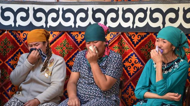 Relatives mourn the death of Turdaaly during a traditional ceremony. The practice of bride kidnapping, known locally as Ala Kachuu, has roots in Kyrgyzstan’s nomadic past and persisted into the Soviet era, albeit on a smaller scale. Some argue that the practice has survived because of social conservatism and a relatively weak tradition of arranged marriages in comparison with neighbouring countries, as well as poverty among rural families who save money for dowries. (Vyacheslav OSELEDKO / AFP) Relatives mourn the death of Turdaaly during a traditional ceremony. The practice of bride kidnapping, known locally as Ala Kachuu, has roots in Kyrgyzstan’s nomadic past and persisted into the Soviet era, albeit on a smaller scale. Some argue that the practice has survived because of social conservatism and a relatively weak tradition of arranged marriages in comparison with neighbouring countries, as well as poverty among rural families who save money for dowries. (Vyacheslav OSELEDKO / AFP)