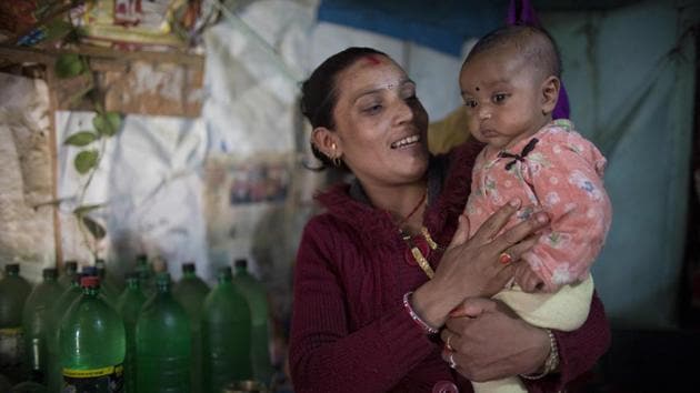 Meera Nepali plays with her son at her home in the Ramechhap district, Nepal. As a teenager Nepali was terrified as she went into labour with her first child at home in a remote village, miles from a hospital with nobody but her mother-in-law to help. “I was a scared, but that was the norm. We didn’t have doctors close by,” Nepali said of her three-day labour. (Bikram Rai / AFP) Meera Nepali plays with her son at her home in the Ramechhap district, Nepal. As a teenager Nepali was terrified as she went into labour with her first child at home in a remote village, miles from a hospital with nobody but her mother-in-law to help. “I was a scared, but that was the norm. We didn’t have doctors close by,” Nepali said of her three-day labour. (Bikram Rai / AFP)