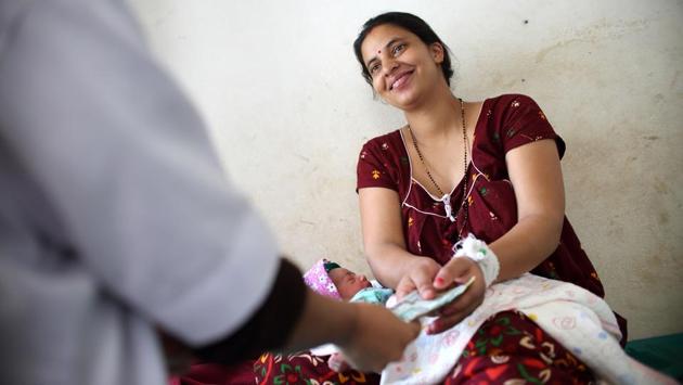 Nepali mother Pabitra Dhungel receiving cash for transportation at a health centre. Today, the programme covers not just transport but medical costs for mothers and babies and includes a cash bonus for attending antenatal check-ups. 2017 marked a milestone: more Nepalese women opted for hospital births over home deliveries for the first time on record, official figures show. (Bikram Rai / AFP) Nepali mother Pabitra Dhungel receiving cash for transportation at a health centre. Today, the programme covers not just transport but medical costs for mothers and babies and includes a cash bonus for attending antenatal check-ups. 2017 marked a milestone: more Nepalese women opted for hospital births over home deliveries for the first time on record, official figures show. (Bikram Rai / AFP)
