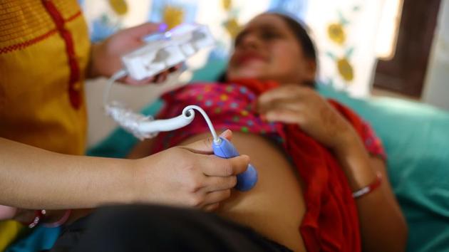 A Nepali health worker checking on a pregnant woman at a health centre in the Ramechhap district, some 100 kms east of Kathmandu. The Aama Surakshya, or "protection for mothers", programme has helped more than two million Nepali women access medical services in the impoverished country where dying in childbirth remains a very real risk. (Bikram Rai / AFP) A Nepali health worker checking on a pregnant woman at a health centre in the Ramechhap district, some 100 kms east of Kathmandu. The Aama Surakshya, or "protection for mothers", programme has helped more than two million Nepali women access medical services in the impoverished country where dying in childbirth remains a very real risk. (Bikram Rai / AFP)