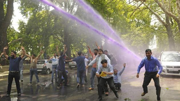 Sarva Shiksha Abhiyan (SSA) teachers raise slogans while marching towards the official residence of governor N N Vohra, demanding implementation of the seventh pay commission recommendations. A large contingent of police was deployed to stop the march, water canons fired and protesting teachers asked to disperse, an official said. (Waseem Andrabi / HT Photo) Sarva Shiksha Abhiyan (SSA) teachers raise slogans while marching towards the official residence of governor N N Vohra, demanding implementation of the seventh pay commission recommendations. A large contingent of police was deployed to stop the march, water canons fired and protesting teachers asked to disperse, an official said. (Waseem Andrabi / HT Photo)