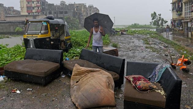 Mohamad Jamil has his furniture pulled out of the house after rainwater made its way in. Hitendra Thakur, MLA from Vasai and chief of Bahujan Vikas Aghadi that runs the Vasai-Virar Municipal Corporation, said that development alone should not be held responsible for the flooding. He argued that geographical factors, high tide too played a role in the scale of waterlogging last week. (Satyabrata Tripathy / HT Photo)