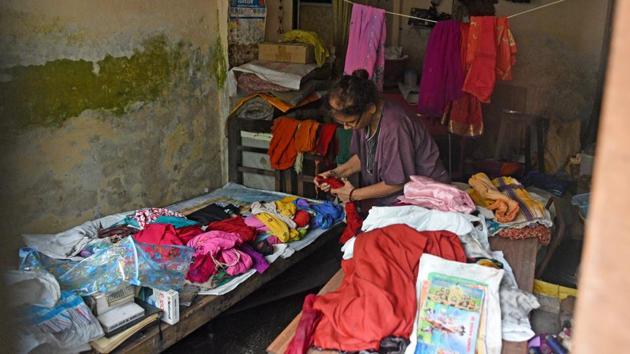 A Nallasopara resident arranges her belongings to evade incoming rainwater. Pankaj Joshi, executive director of Mumbai-based Urban Design Research Institute (UDRI) echoed Mahajan’s view. “Other than Mumbai, very little heed is paid to environmental position —which is a low-lying area, which is flood-prone area, which is the watershed, etc.” (Satyabrata Tripathy / HT Photo)