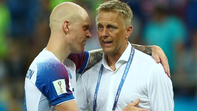 Heimir Hallgrimsson talks with with Emil Hallfredsson at the end of their FIFA World Cup 2018 match.(REUTERS)