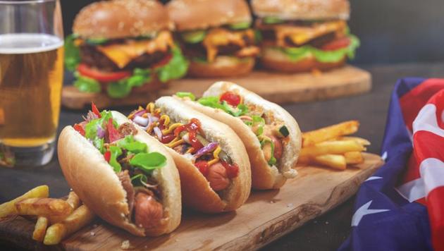 Hot dogs and other processed meat snacks can contribute to mania, an abnormal mood state characterised by hyperactivity, euphoria and insomnia.(Shutterstock)