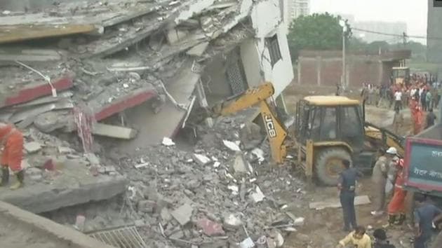 The incident occurred around 10pm in Shahberi village of Bisrakh when a five-storey building collapsed on an adjacent under-construction building, officials said. (ANI Photo/Twitter) The incident occurred around 10pm in Shahberi village of Bisrakh when a five-storey building collapsed on an adjacent under-construction building, officials said. (ANI Photo/Twitter)