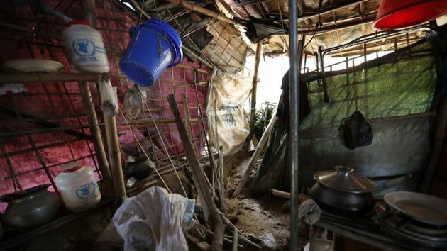 Abu Bakker’s home, destroyed by a landslide, seen in Chakmarkul camp. His family lives at the base of a hill where a landslide destroyed eight shelters. Adding to worriers are risks of waterborne diseases like cholera. Some of the latrines are piled high with fly-riddled excrement, which seeps out the sides during downpours. Water pumps are generally just a few meters away — worse, some are located downhill. (Wong Maye-E / AP) Abu Bakker’s home, destroyed by a landslide, seen in Chakmarkul camp. His family lives at the base of a hill where a landslide destroyed eight shelters. Adding to worriers are risks of waterborne diseases like cholera. Some of the latrines are piled high with fly-riddled excrement, which seeps out the sides during downpours. Water pumps are generally just a few meters away — worse, some are located downhill. (Wong Maye-E / AP)