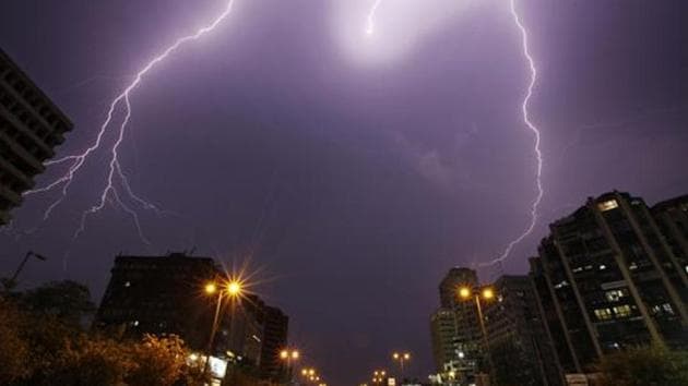 Lightning over Connaught Place area in New Delhi on Friday, July 06, 2012. (HT File Photo) Lightning over Connaught Place area in New Delhi on Friday, July 06, 2012. (HT File Photo)