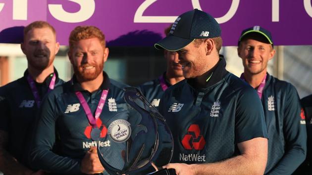 England's captain Eoin Morgan (C) holds the series trophy after the third One Day International (ODI) cricket match between England and India. (AFP)