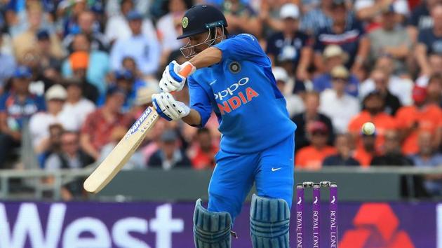 India's MS Dhoni reacts after playing a shot to be caught out by England's Jos Buttler for 42 runs during the third One Day International (ODI) cricket match. (AFP)