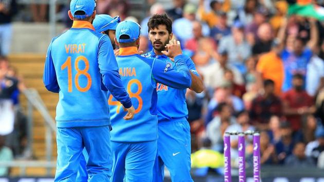 India's Shardul Thakur (R) celebrates with team mates after taking the wicket of England's Jonny Bairstow for 30. (AFP)