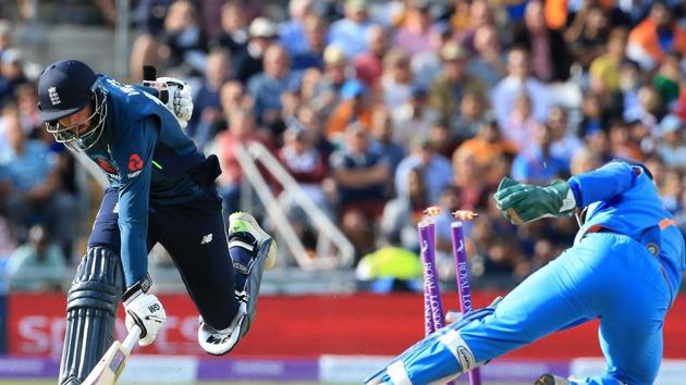 India's MS Dhoni (R) runs out the England's James Vince for 27 runs. (AFP)