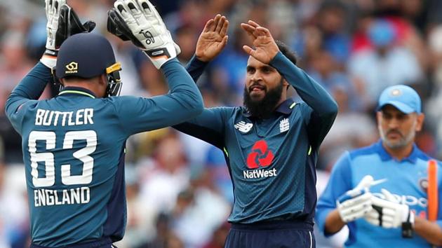 England's Adil Rashid celebrates taking the wicket of India's Virat Kohli. (Action Images via Reuters)