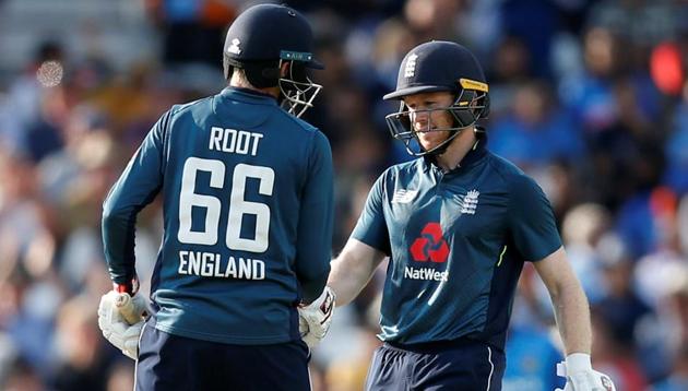 England's Eoin Morgan celebrates after reaching a half century with Joe Root during the 3rd ODI against India in Headingley.(Action Images via Reuters)