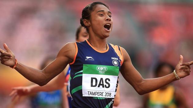 Hima Das celebrates after winning gold in the final of the women's 400m on day three of the IAAF World U20 Championships.(PTI)