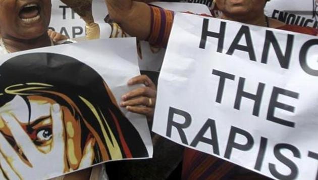 FILE - In this Aug 23, 2013 file photo, activists hold placards demanding rapists be hanged as they protest against the gang rape of a 22-year-old woman photojournalist in Mumbai India. (AP) FILE - In this Aug 23, 2013 file photo, activists hold placards demanding rapists be hanged as they protest against the gang rape of a 22-year-old woman photojournalist in Mumbai India. (AP)