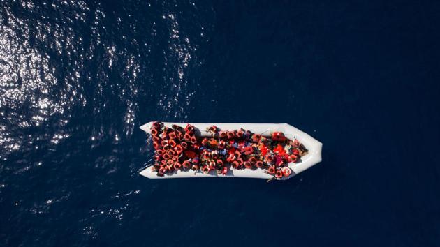 Refugees and migrants wait to be rescued by members of the Spanish NGO Proactiva Open Arms, after leaving Libya trying to reach European soil aboard an overcrowded rubber boat, north of Libyan coast, Sunday, May 6, 2018. (AP File Photo) Refugees and migrants wait to be rescued by members of the Spanish NGO Proactiva Open Arms, after leaving Libya trying to reach European soil aboard an overcrowded rubber boat, north of Libyan coast, Sunday, May 6, 2018. (AP File Photo)