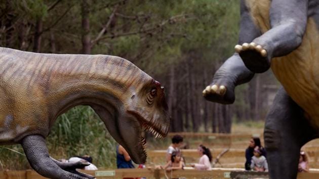 People visit the Dino Park, an outdoor museum with more than 120 models of dinosaurs, in Lourinha.(AFP Photo)