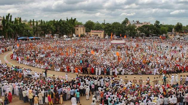 Thousands of varkaris (devotees) participate in 'Gol Ringan' during Sant Tukaram Palkhi procession at Akluj in Solapur. (PTI) Thousands of varkaris (devotees) participate in 'Gol Ringan' during Sant Tukaram Palkhi procession at Akluj in Solapur. (PTI)