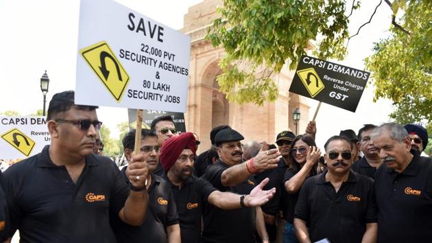 Ex- Army officers and members of Central Association of Private Security Industry (CAPSI) participate in a silent protest at India Gate to bring to the notice of the Government the problems faced by private security industry due to the imposition of the GST rule in New Delhi. (Sonu Mehta / HT Photo) Ex- Army officers and members of Central Association of Private Security Industry (CAPSI) participate in a silent protest at India Gate to bring to the notice of the Government the problems faced by private security industry due to the imposition of the GST rule in New Delhi. (Sonu Mehta / HT Photo)