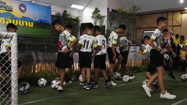 Some of the twelves boys, dramatically rescued from deep inside a Thai cave after being trapped for more than a fortnight, play with soccer balls before a press conference in Chiang Rai on July 18, 2018, following their discharge from the hospital. (AFP) Some of the twelves boys, dramatically rescued from deep inside a Thai cave after being trapped for more than a fortnight, play with soccer balls before a press conference in Chiang Rai on July 18, 2018, following their discharge from the hospital. (AFP)