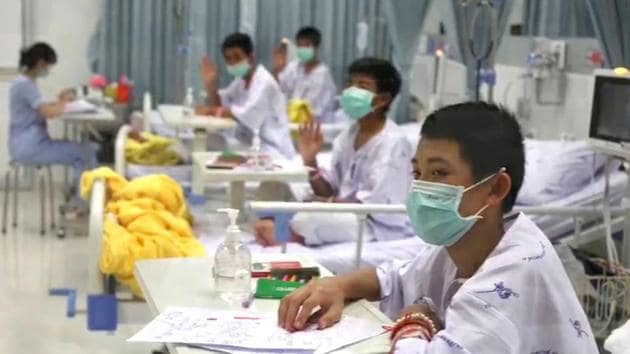 This frame grab from handout video footage taken on July 13, 2018 and released by the Ministry of Health shows rescued "Wild Boars" football team members recovering at the hospital in Chiang Rai province. (AFP Photo) This frame grab from handout video footage taken on July 13, 2018 and released by the Ministry of Health shows rescued "Wild Boars" football team members recovering at the hospital in Chiang Rai province. (AFP Photo)