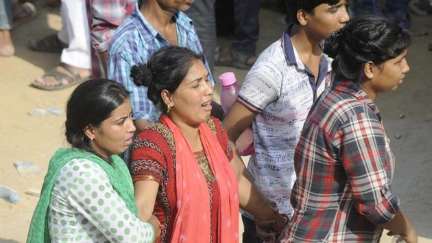 Relatives of the victims who died in the Greater Noida buildings collapse in Shahberi village on July 17, 2018.(Sunil Ghosh/ HT Photo) Relatives of the victims who died in the Greater Noida buildings collapse in Shahberi village on July 17, 2018.(Sunil Ghosh/ HT Photo)