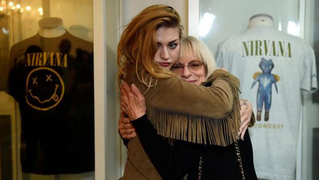 Kurt Cobain’s daughter Frances Bean Cobain hugs her grandmother Wendy O’Connor at the opening of exhibition. “There is an association that is shameful and it shouldn’t be,” said Frances Bean, who has also struggled with addiction. “It’s taboo... despite the fact that it is present in our society every single day.” (Clodagh Kilcoyne / REUTERS)